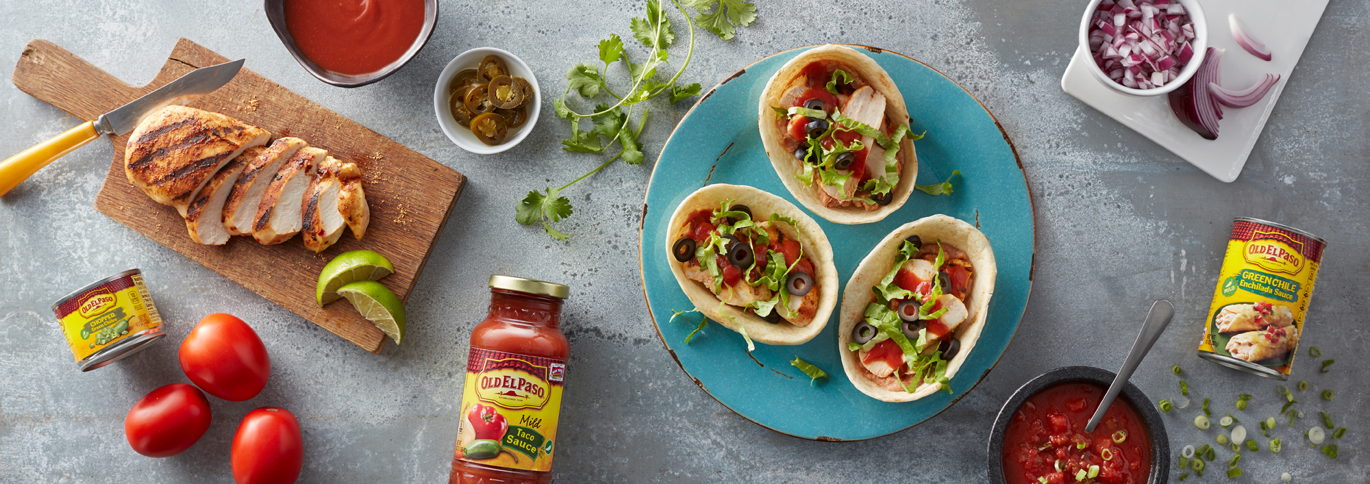 Assortment of Old El Paso sauces and toppings, including salsa, taco sauce, and condiments for Mexican-inspired meals.